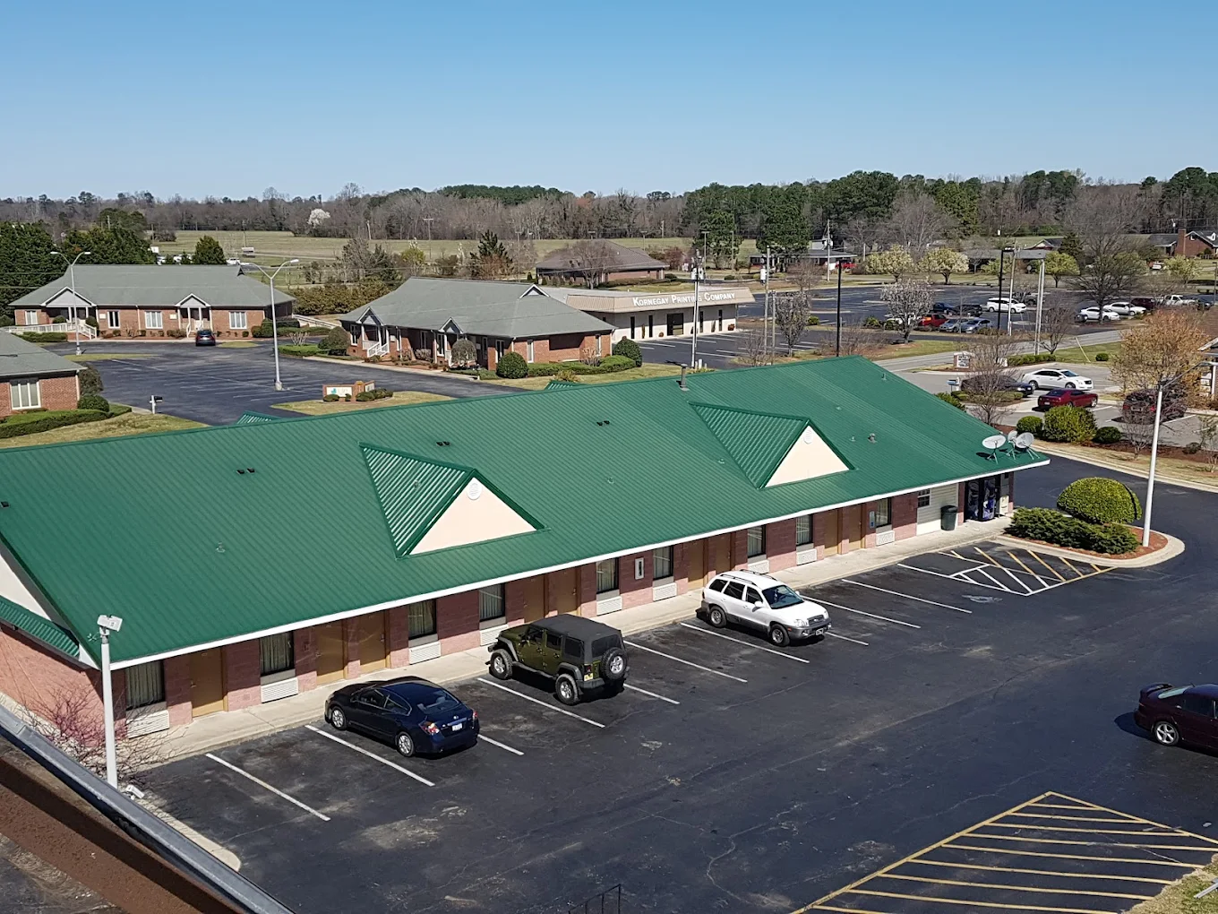 Exterior view of Lodge Inn and parking lot